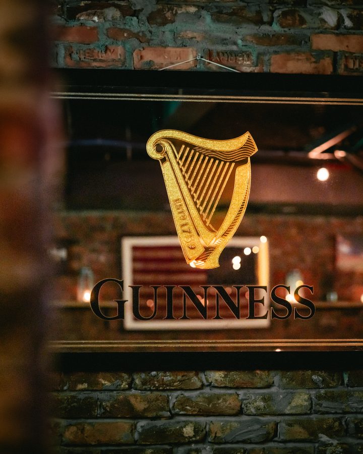 The Guinness harp etched into the Cellar Bar window