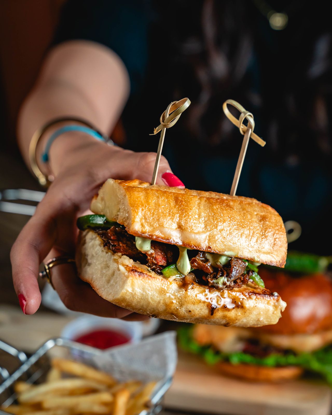 A steak sandwich and fries at Printers Alley